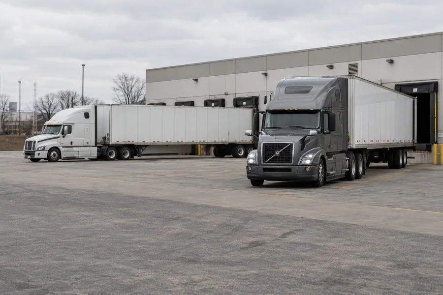 Tractors and trailers at freight loading docks
